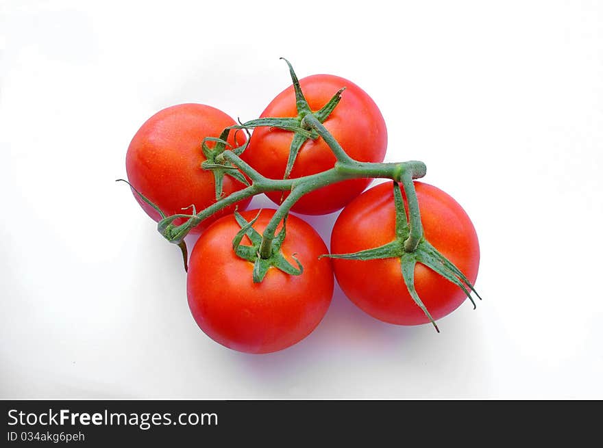 Red tomatos isolated on white