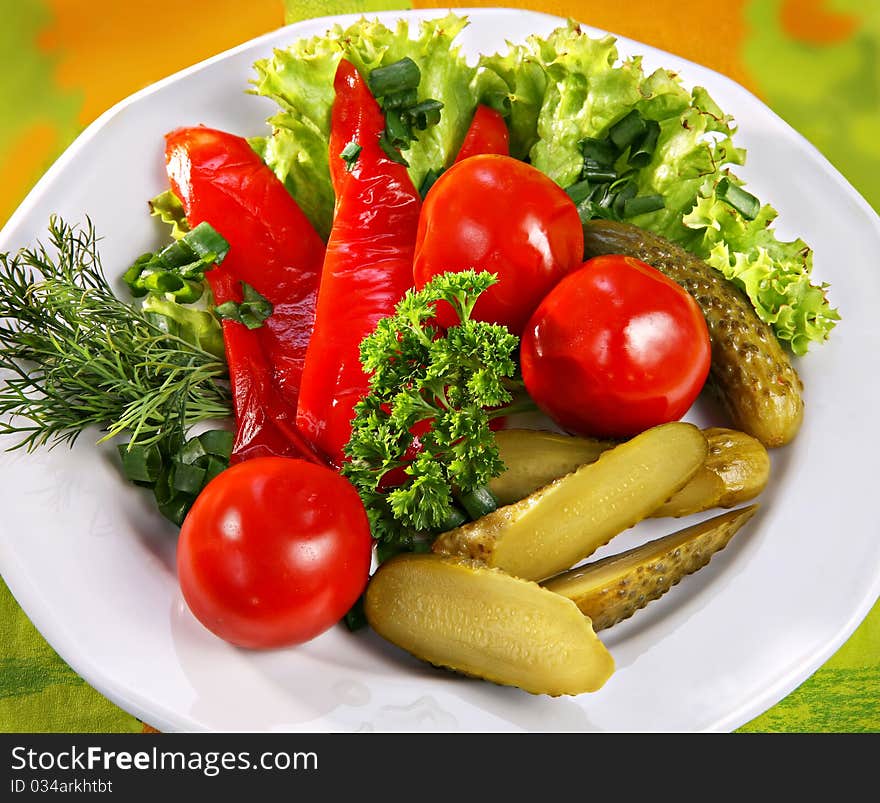 Marinaded vegetables on white plate