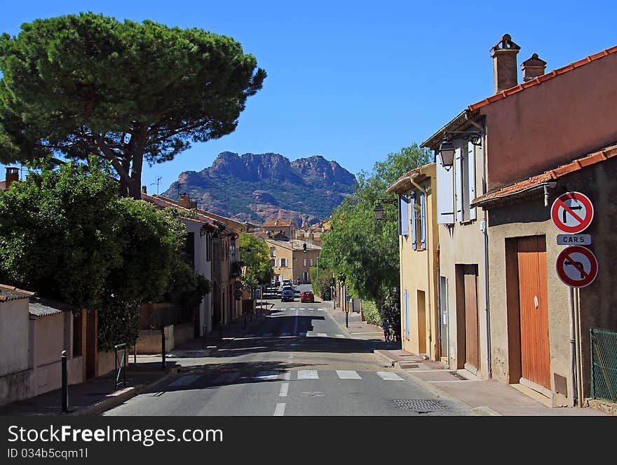 The village of Roquebrune with the Massif D'Roquebrune towering above it, Roquebrune, The Var, France. The village of Roquebrune with the Massif D'Roquebrune towering above it, Roquebrune, The Var, France.