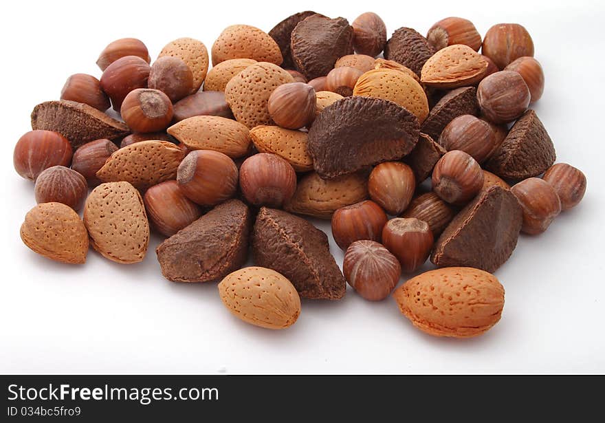 Mixed nuts on a plain white background.