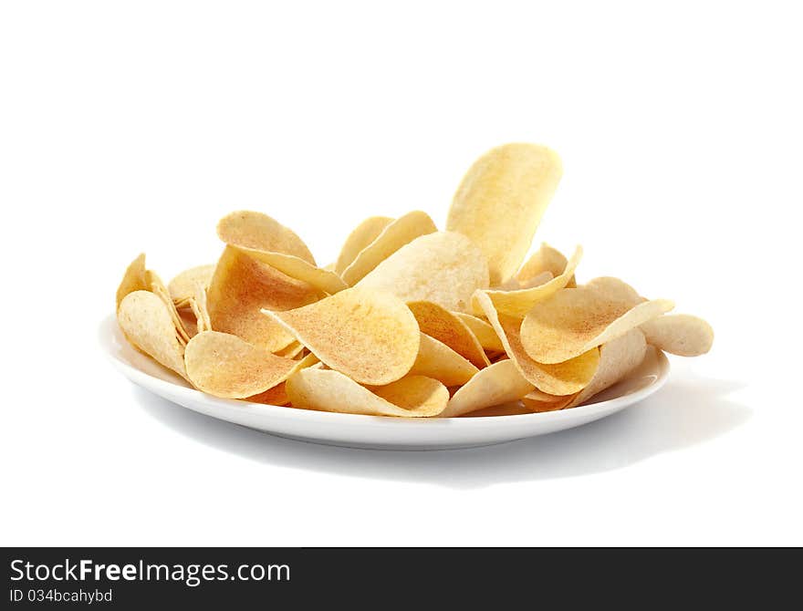 Potato chips on a plate on a white background