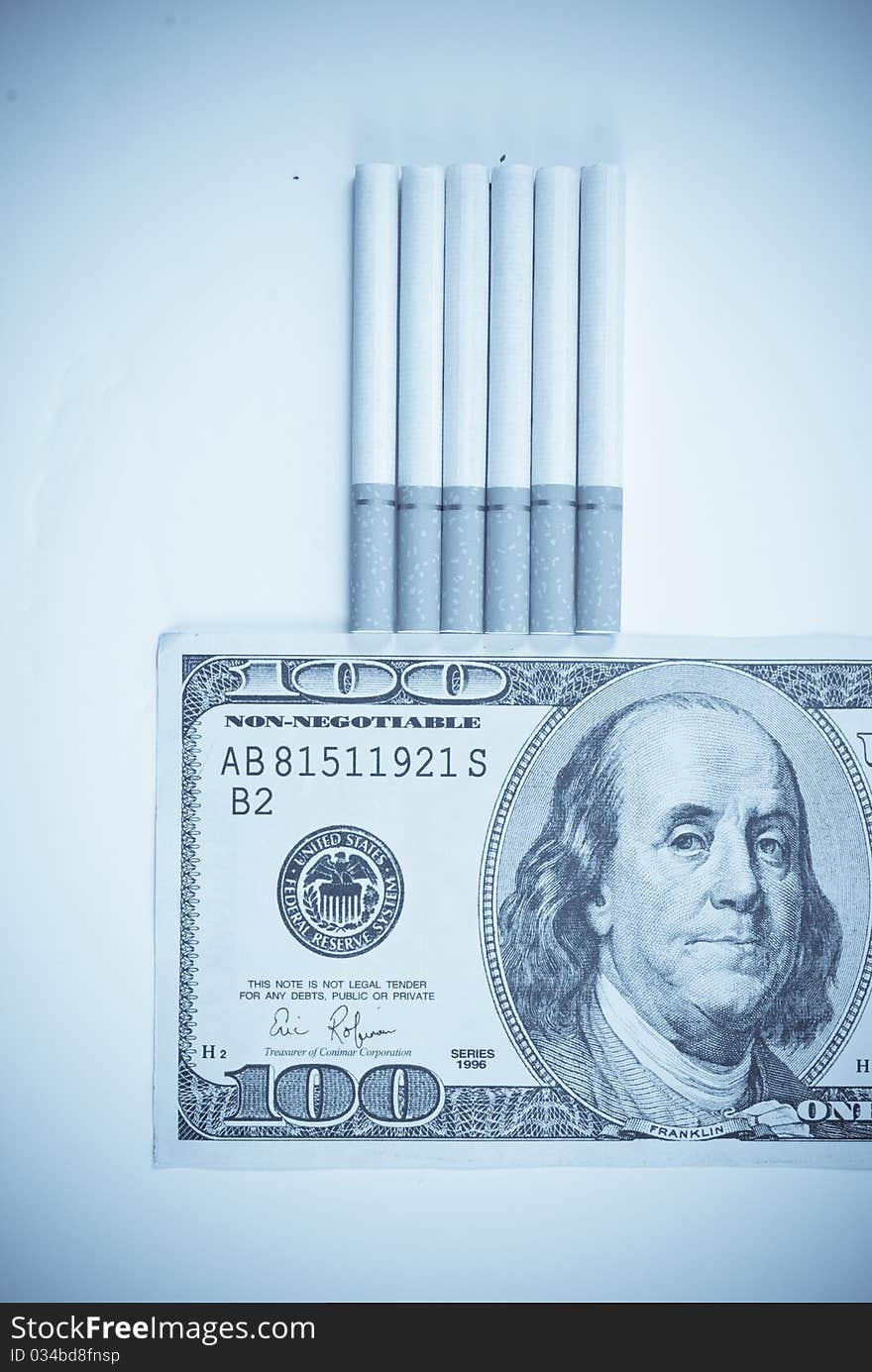 The Costs of a Smoking Habit With A Fake 100 Dollar Bill And Abstract Treatment For Mood