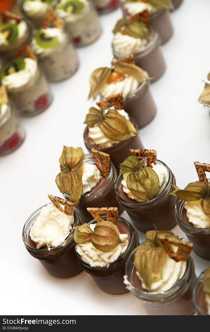 Sweet dessert decorated with cream served in glass close-up