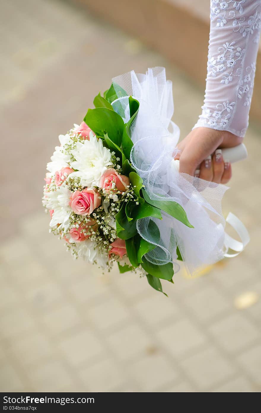 Wedding Bouquet In Hands Of The Bride