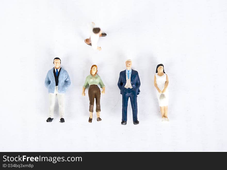 Miniature people on white background. Miniature people on white background