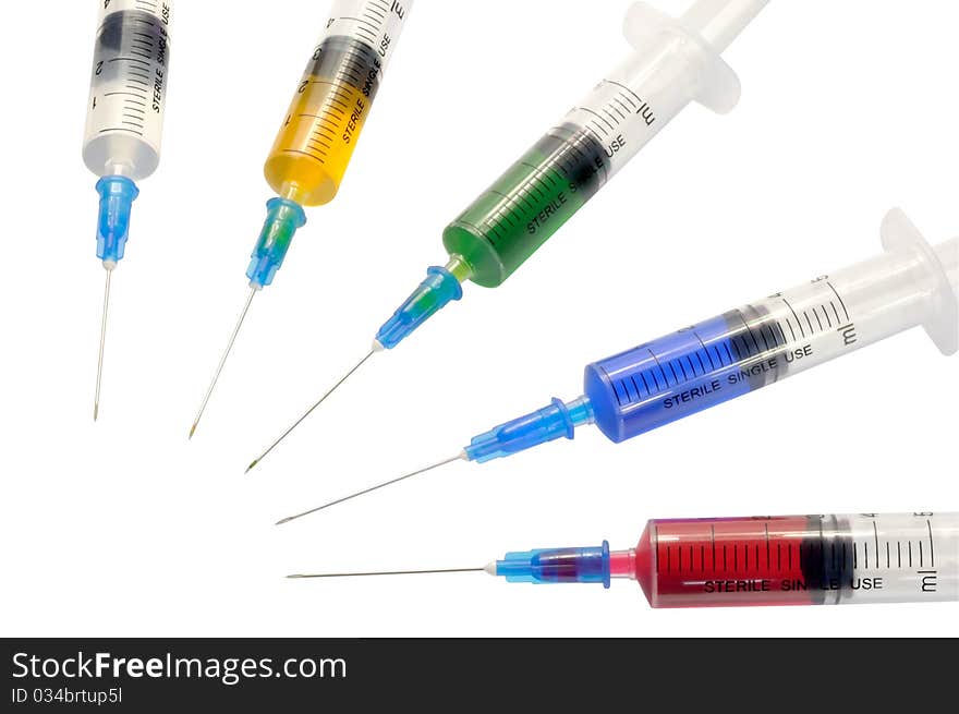 Five disposable syringe against white background