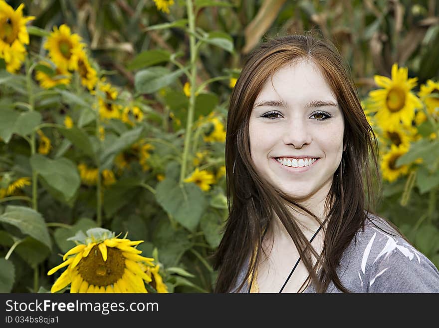 Teenage girl in a field of sunflowers