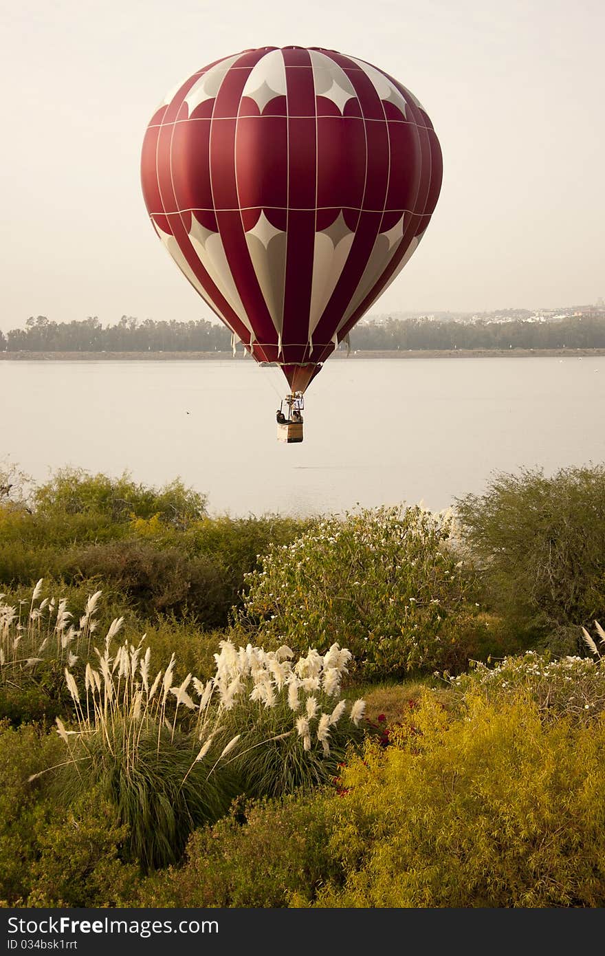 Red, white, and silver hot air balloon