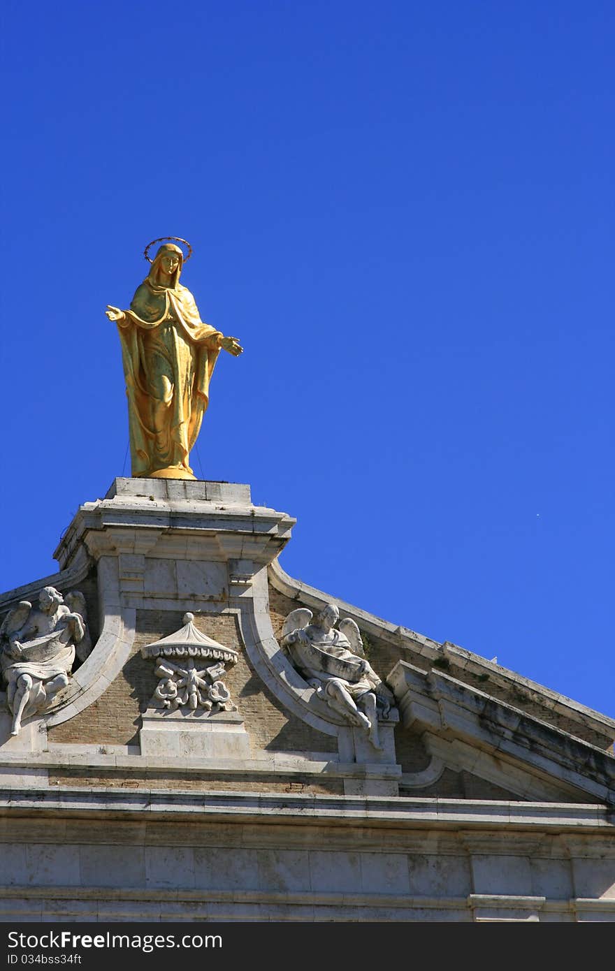 Madonna on top of a church in Assisi