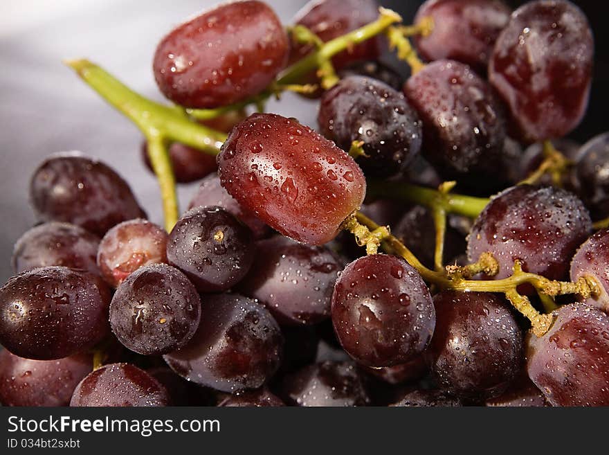 Bunch of wet red grapes