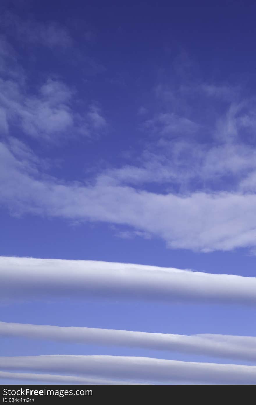 Unusual cloud formations shot against a bright blue sky