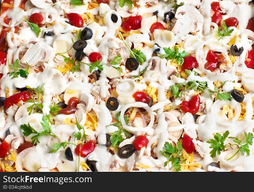 Pizza in baking tray waiting for oven