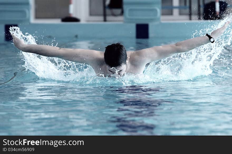 Swimmer swimming in the waterpool