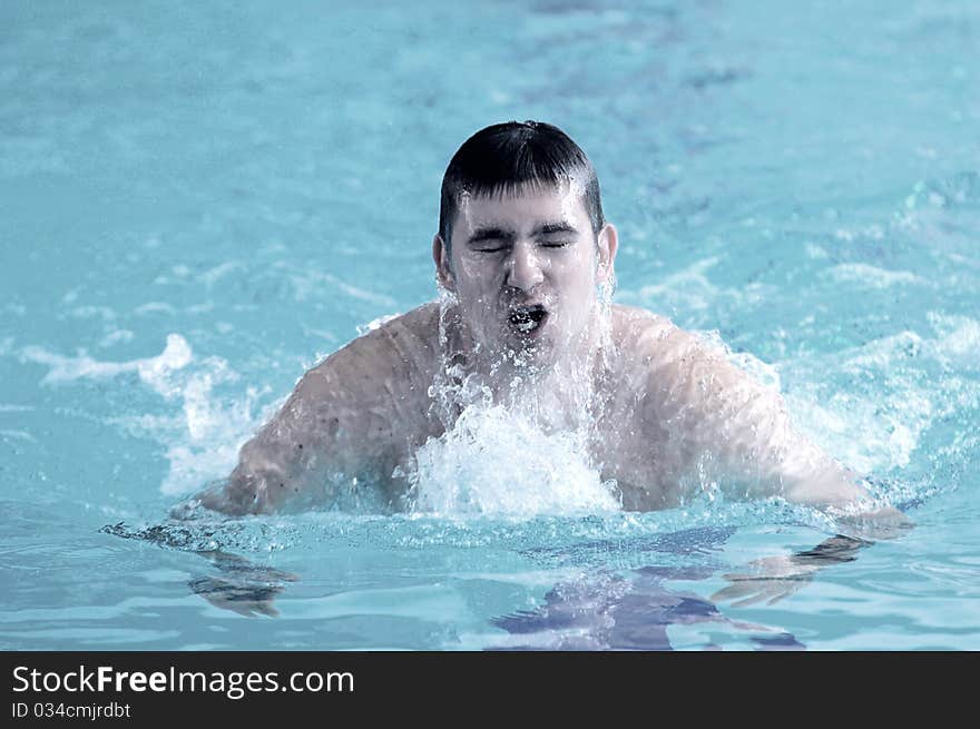 Swimmer swimming in the waterpool