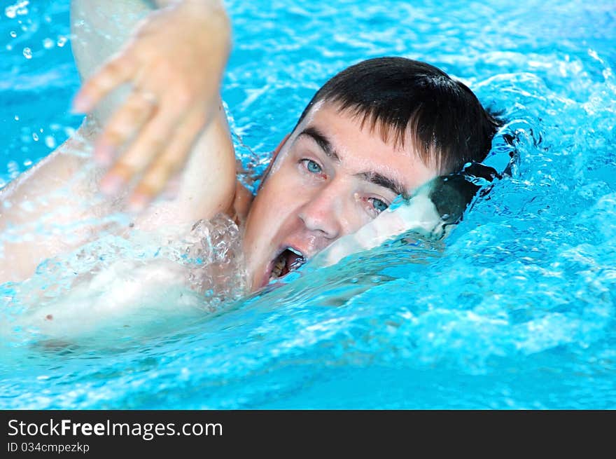 Swimmer swimming in the waterpool