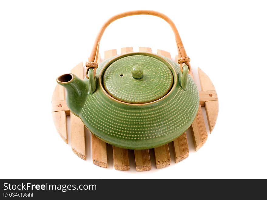 Green teapot on stand