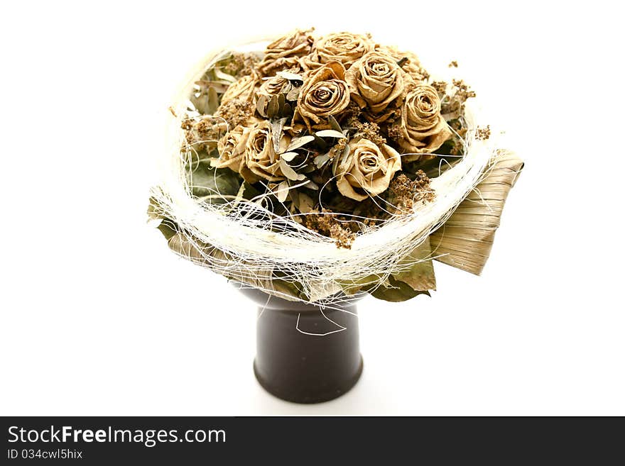 Dried bunch of roses in the vase