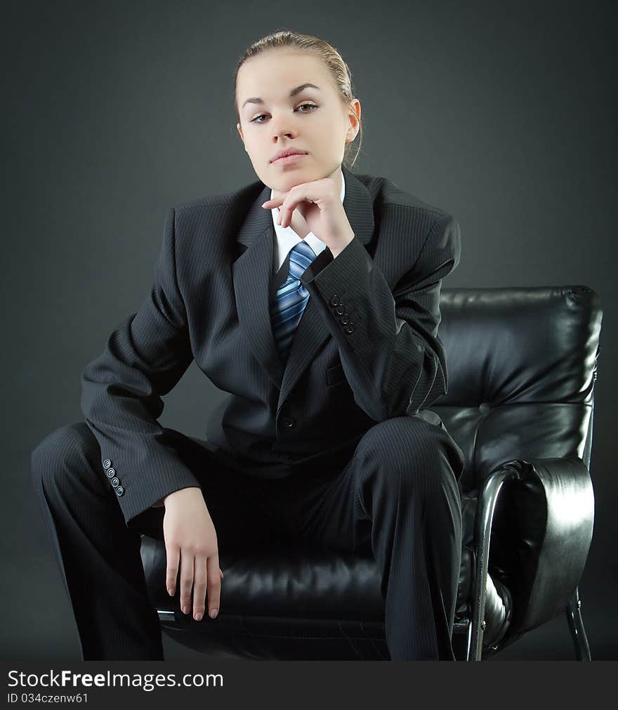 Portrait of the young woman in a man's suit. Portrait of the young woman in a man's suit