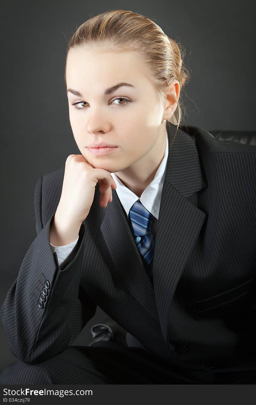 Portrait of the young woman in a man's suit. Portrait of the young woman in a man's suit