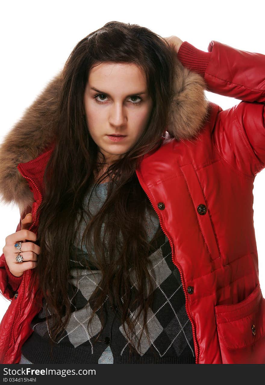 The girl in a red jacket on a white background