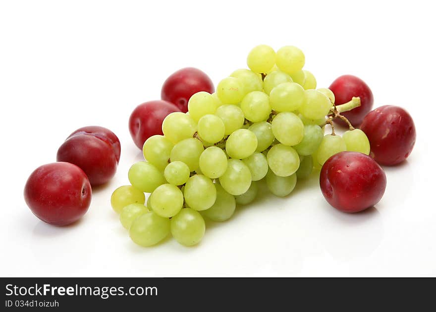 Fresh fruit and berries on a white background