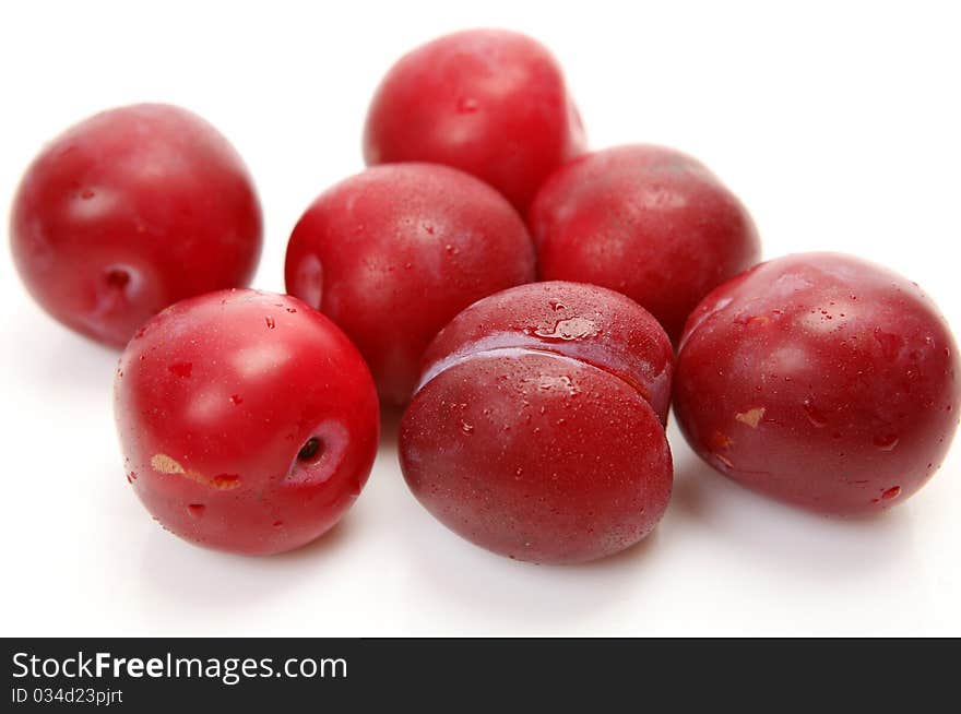 Fresh fruit and berries on a white background