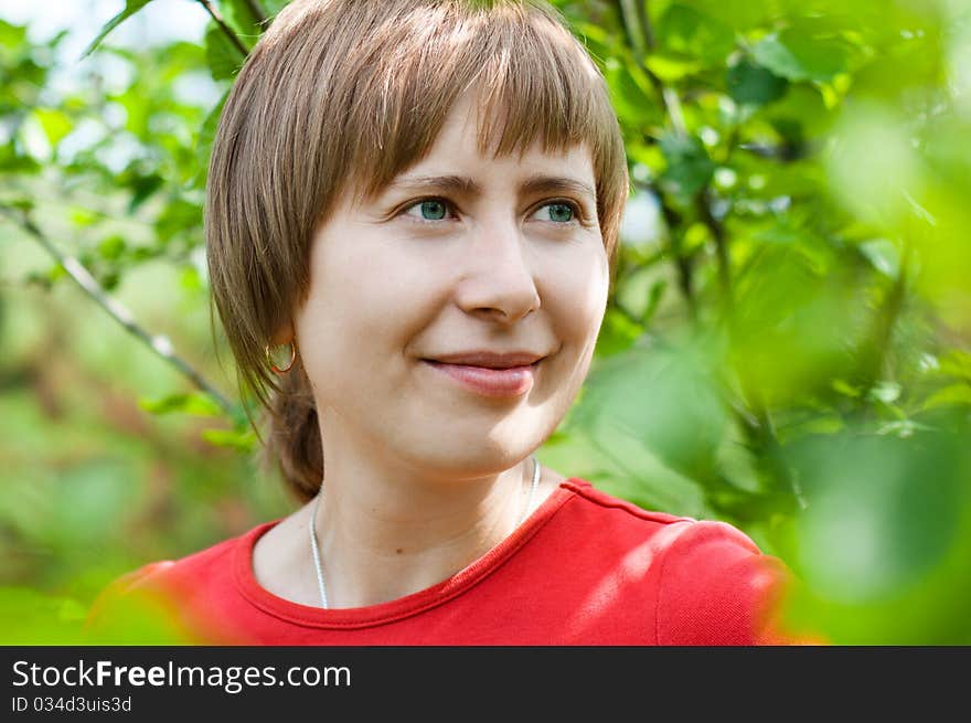 Friendly girl portrait outdoors smiling and looking up