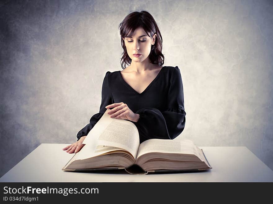 Beautiful woman reading a book