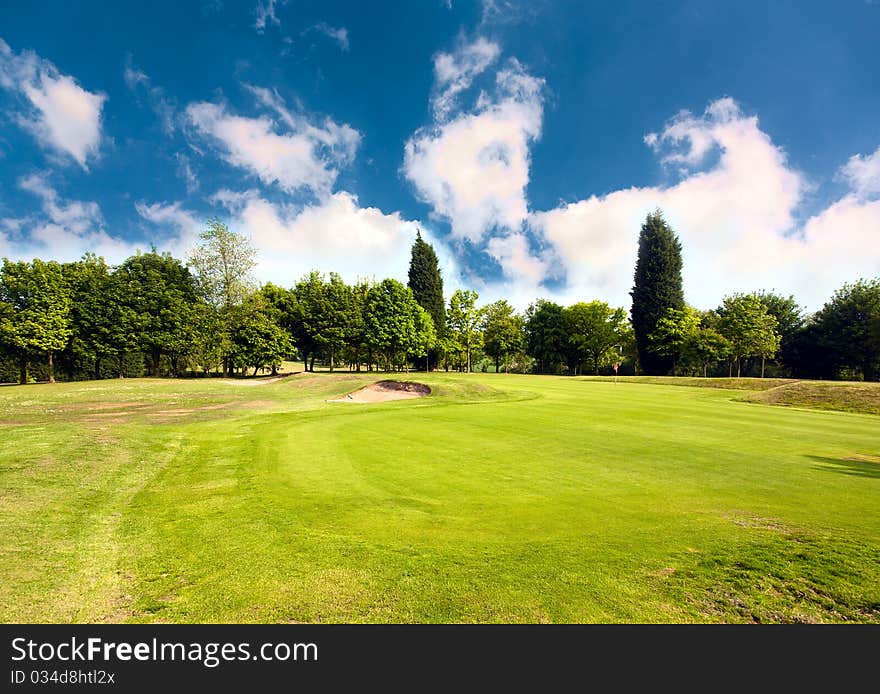 Beautiful golf course surrounded with bunkers