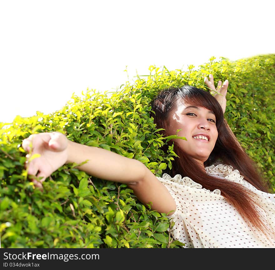 Beautiful girl lying down of grass. Copy space