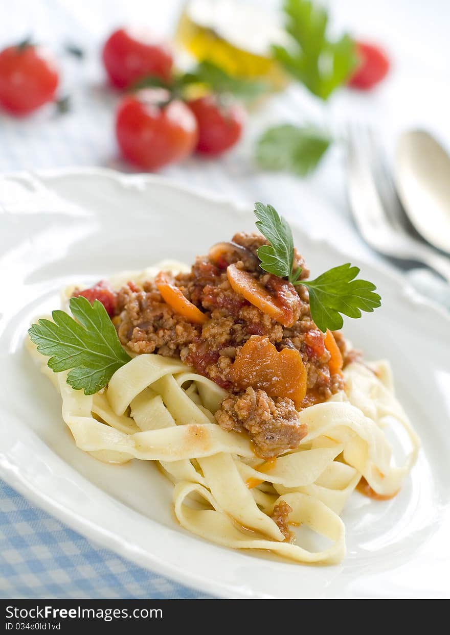 Pasta with meat sauce and parsley