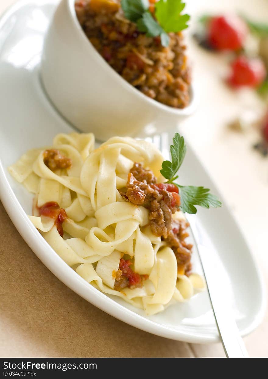 Pasta with meat sauce and parsley