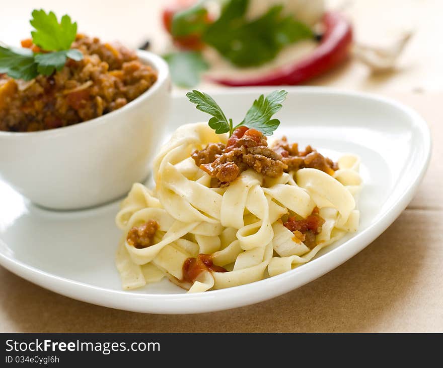 Pasta with meat sauce and parsley