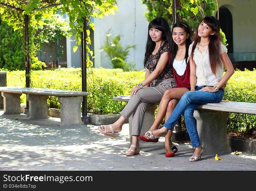 Three best girlfriends in the garden