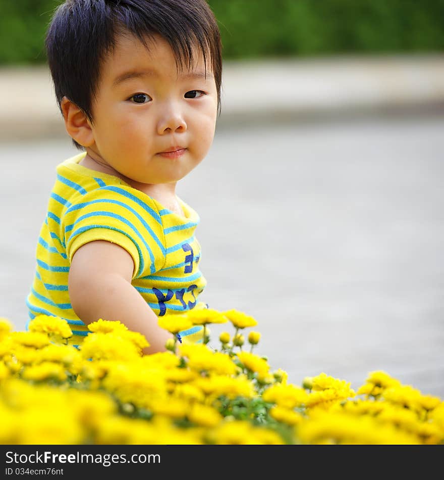 A cute baby is playing in garden