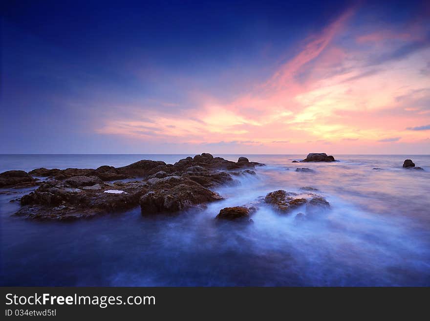 Sea waves lash line impact rock on the beach. Sea waves lash line impact rock on the beach