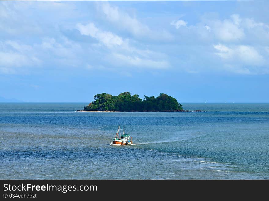 Fisherman boat and island