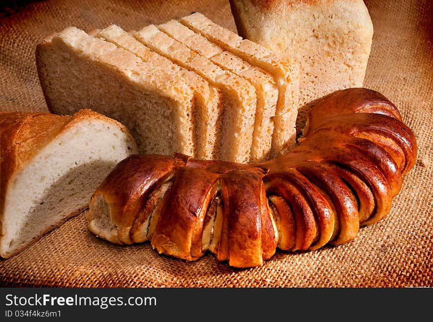 Pieces of bread on brown fabric