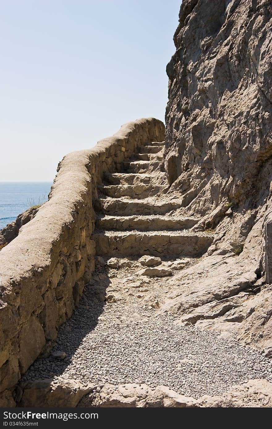 Path with steps around a rock in Novyj Svet, Crimean peninsula.