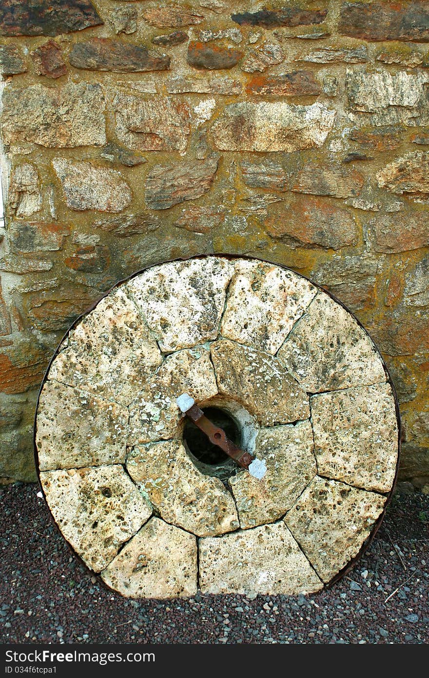 A old limestone mill stone. A old limestone mill stone