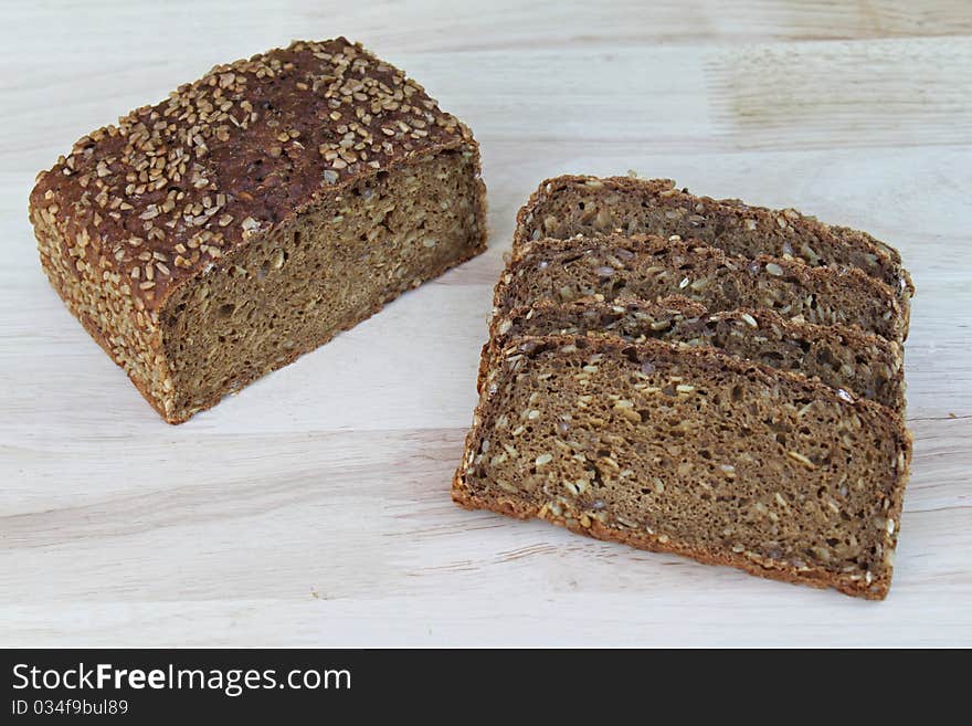 Sliced wholemeal bread on a work surface. Sliced wholemeal bread on a work surface