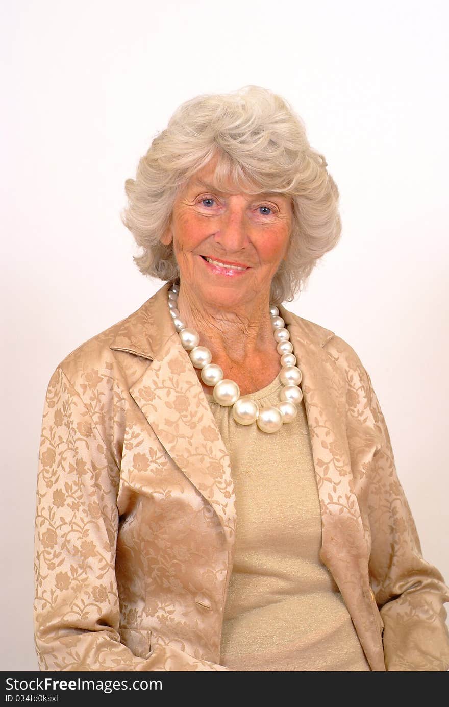 Attractive elderly lady smiling with silver hair