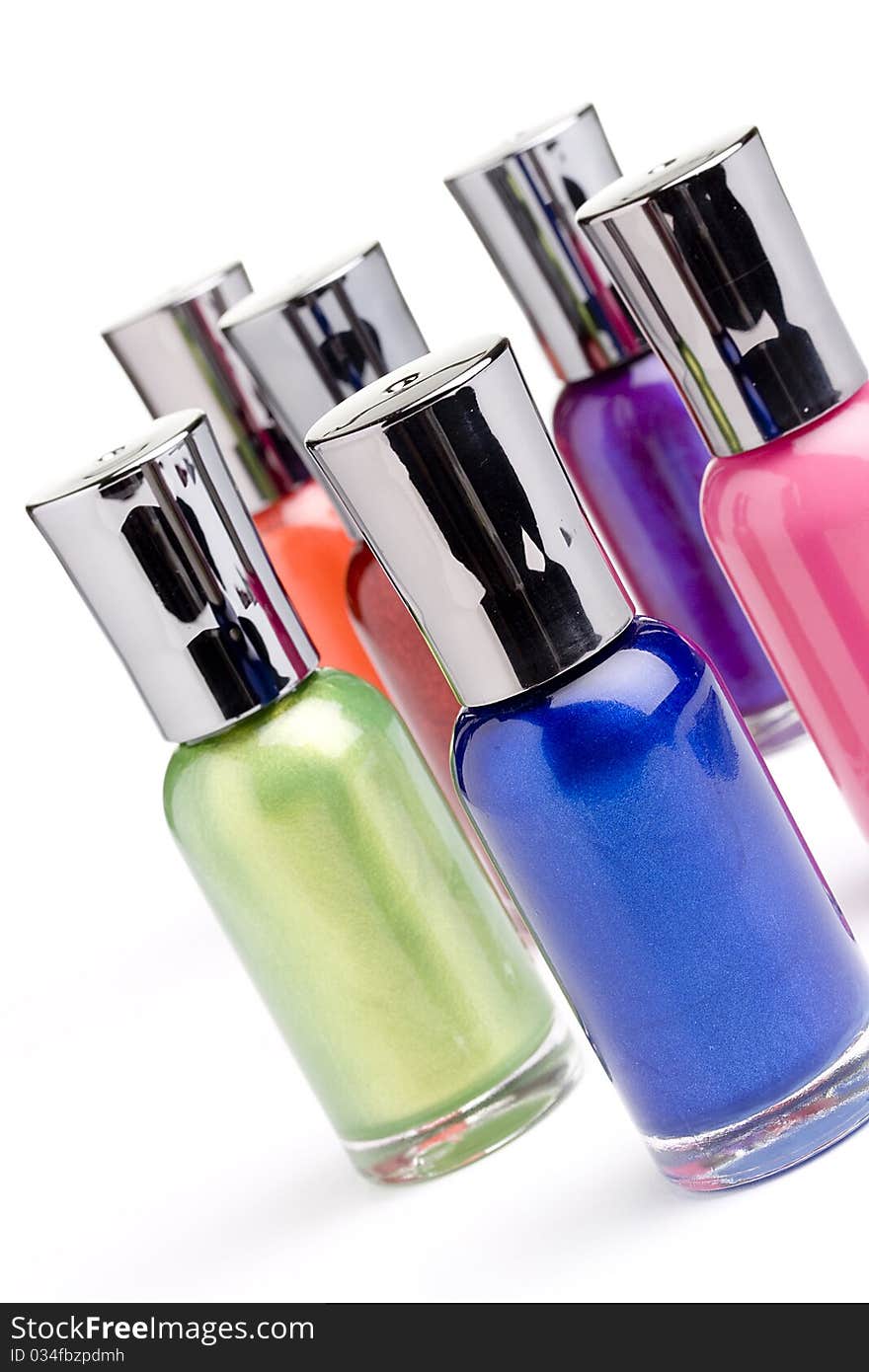 Nail polish bottles placed in front of a white background.