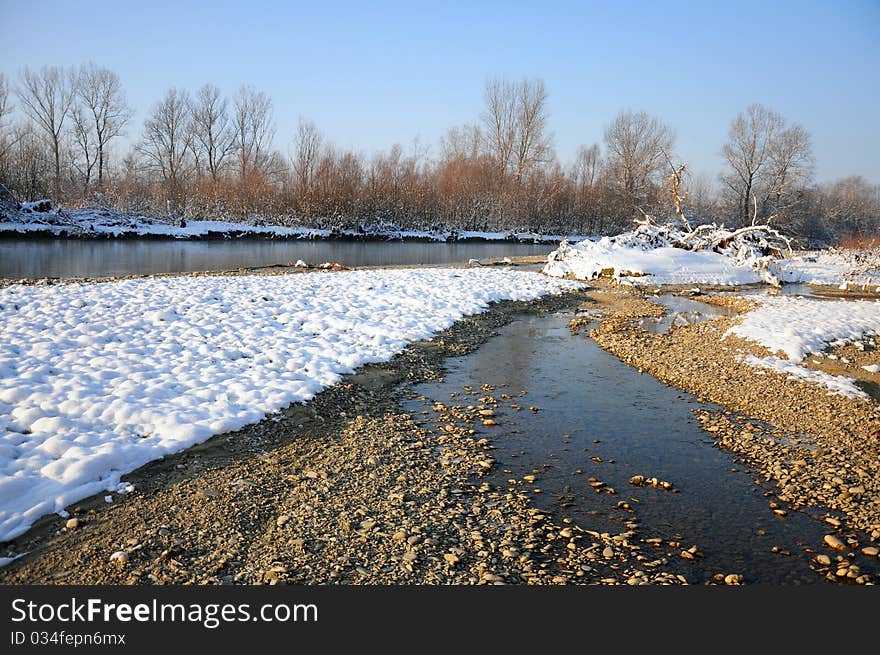 Frosty river in sunny winter day