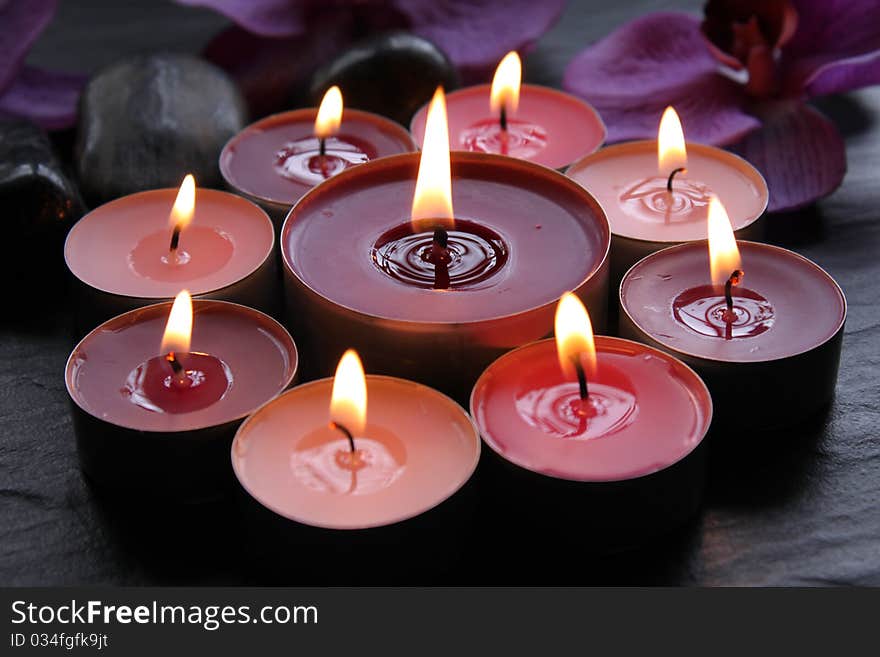 Lighted candles on a black background. Lighted candles on a black background