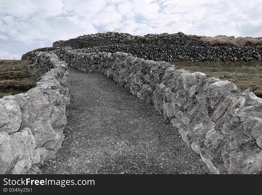 Stone walls and gravel path