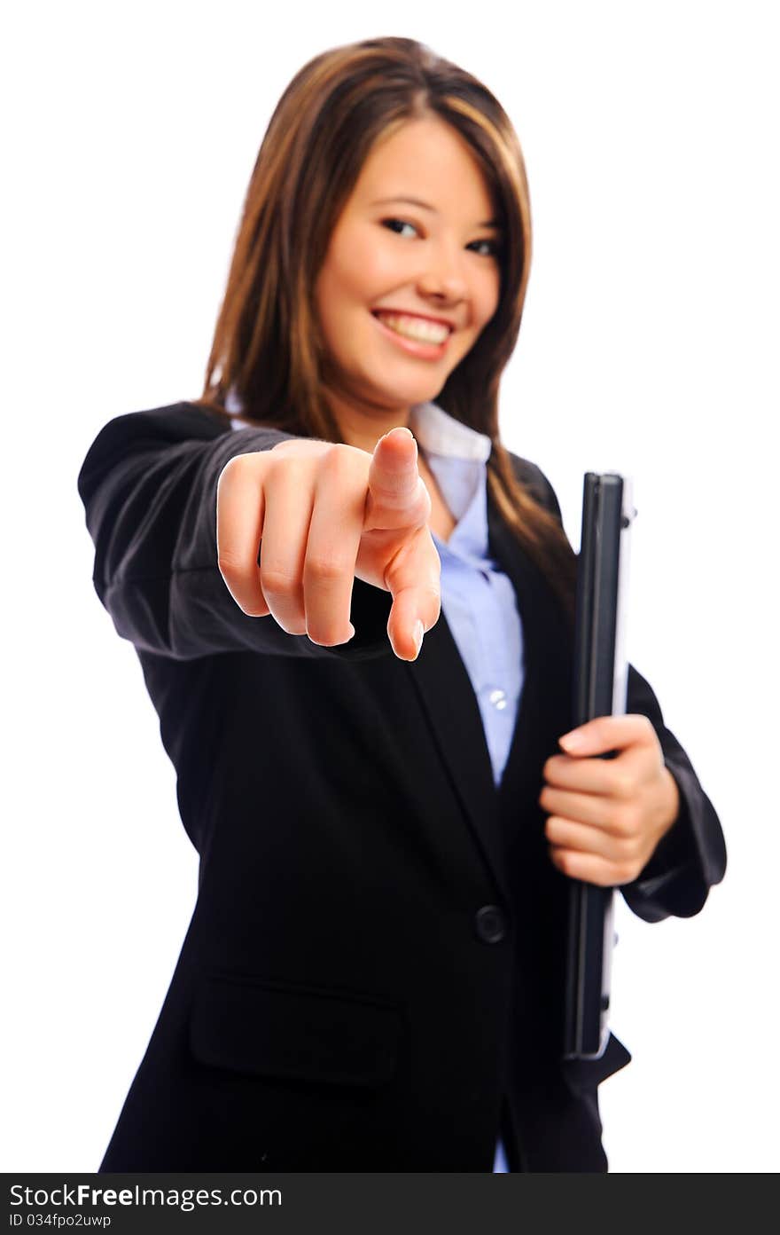 Businesswoman pointing into camera