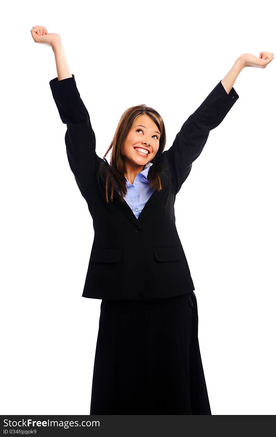 Happy buisnesswoman raises her arms to signify success. Happy buisnesswoman raises her arms to signify success