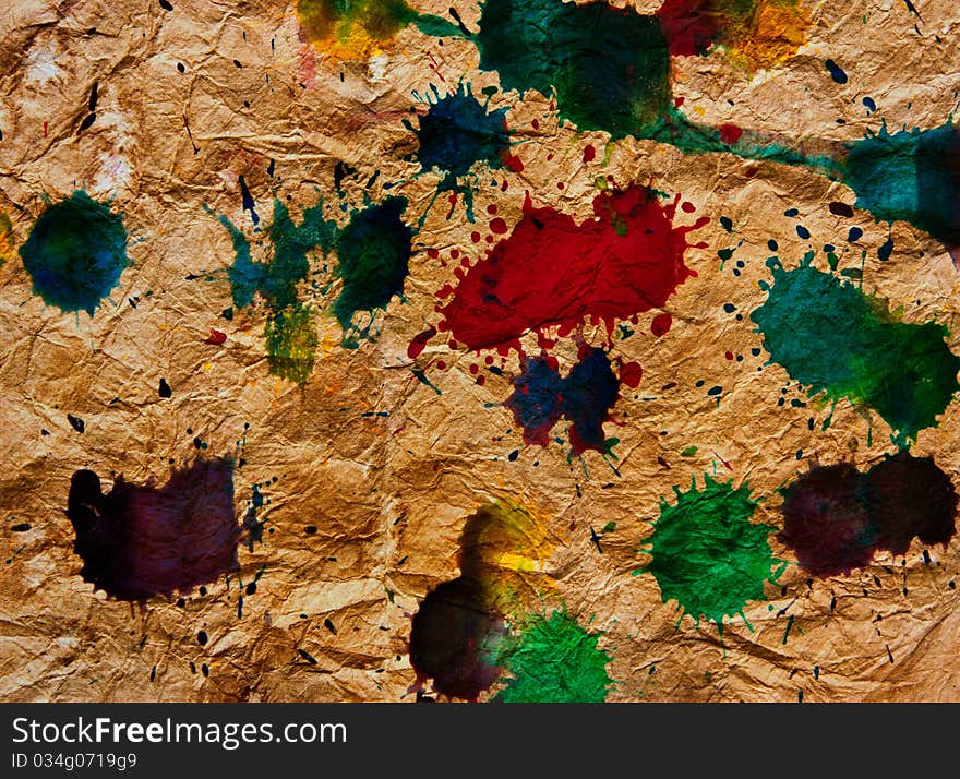 Abstract multicolor splash on Wrinkled old brown paper texture. Abstract multicolor splash on Wrinkled old brown paper texture