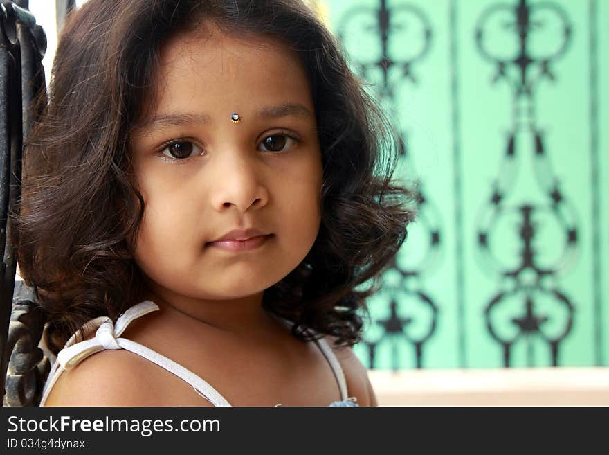 Portrait Of  Indian Girl Posing to the Camera. Portrait Of  Indian Girl Posing to the Camera